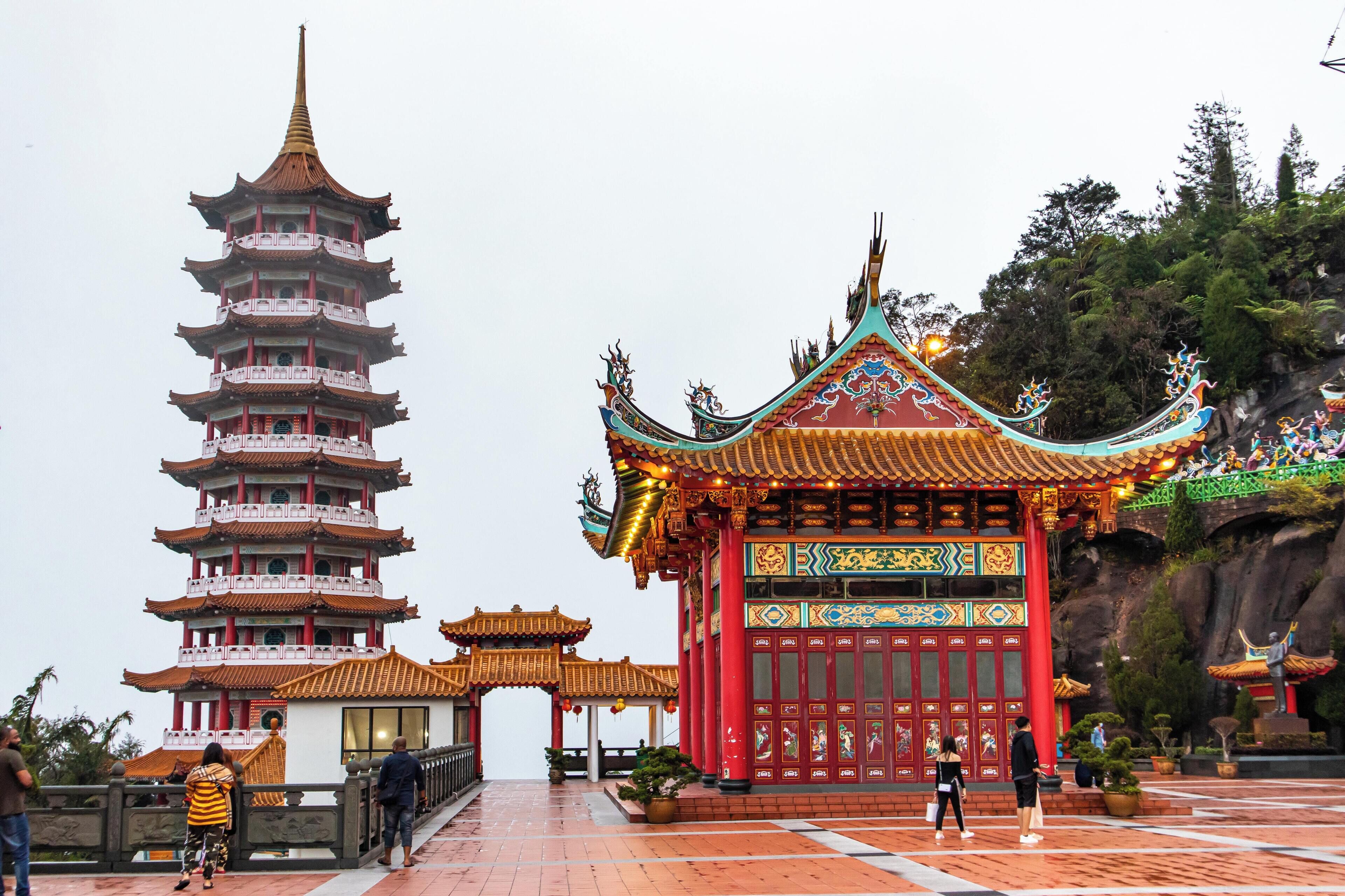 A traditional multi-tiered pagoda and a vibrant temple with intricate roof designs.