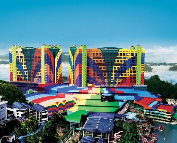 A large hotel complex with multiple colorful buildings and a central structure with a curved roof. - Le Vert Boutique Hotel (Genting Highlands)