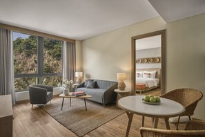 Rock Suite | Living area | 43-inch Smart TV with cable channels, TV - Boma Resort Nha Trang (Nha Trang)