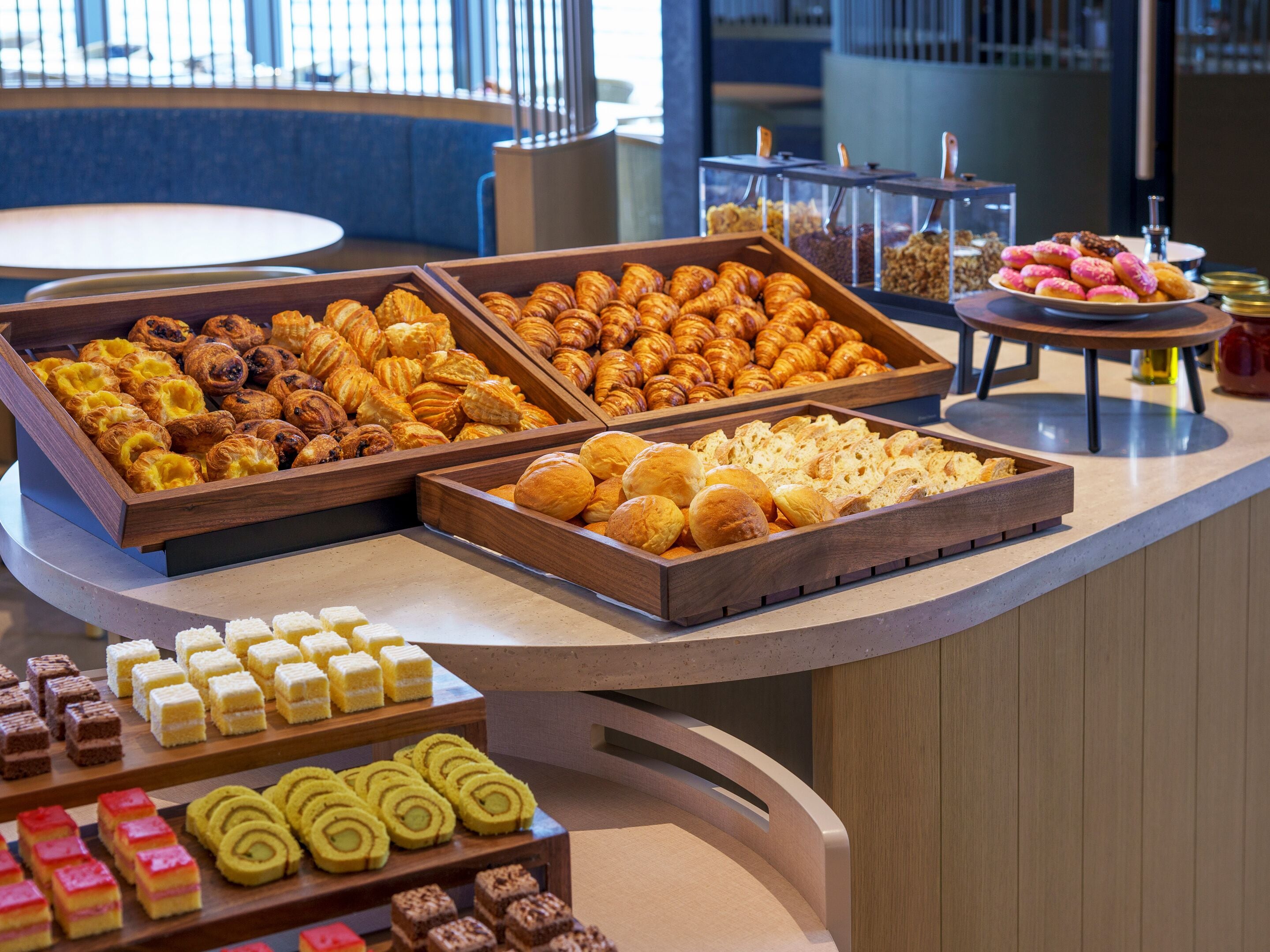 A buffet with various pastries and desserts.