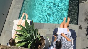 A rectangular pool with clear water, surrounded by a concrete deck. - Luxury family haven (OCEAN GROVE)
