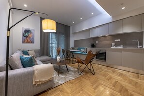 A modern apartment with a living room, dining area, and kitchen. - Phaedrus Living: City Center Lux Flat Kolonaki (Athens)