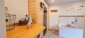 Bathtub, hair dryer, towels, soap