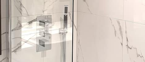 Combined shower/tub, hair dryer, towels, toilet paper