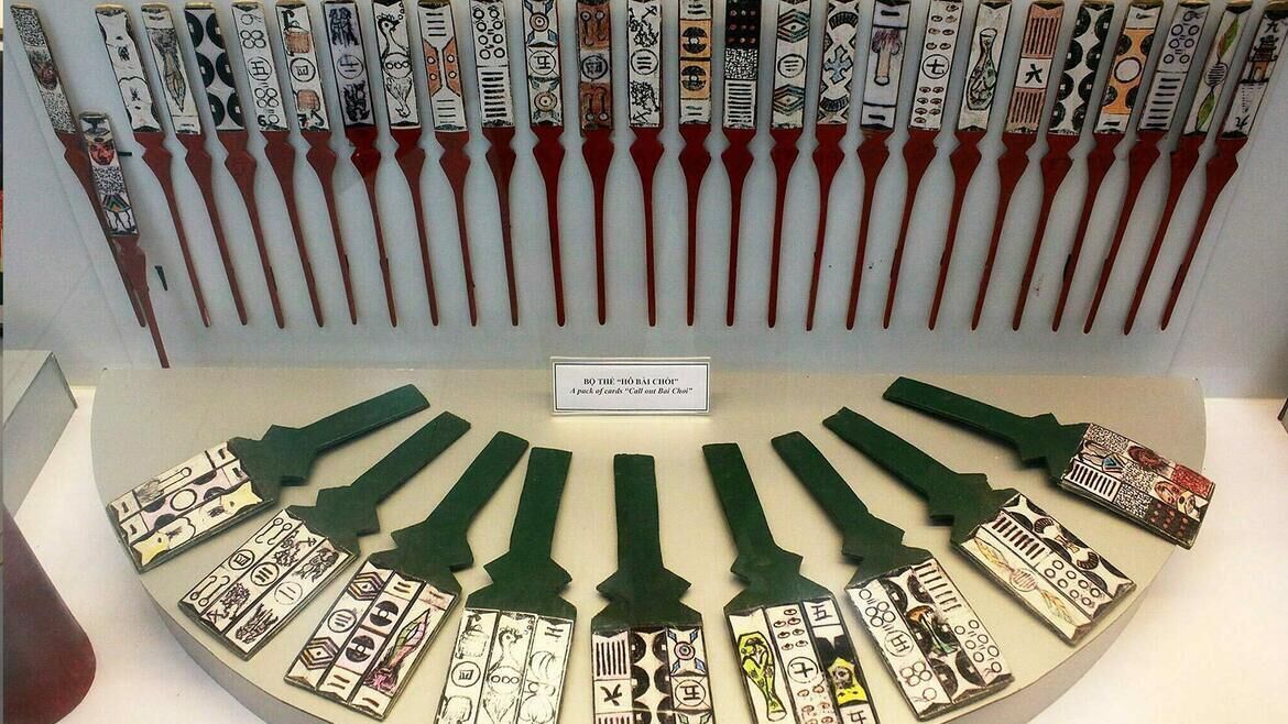 A display of chopsticks with various designs, arranged in two rows.