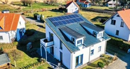 Modern vacation home Bodden-Adler with direct water view