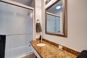 Combined shower/tub, hair dryer, towels, soap