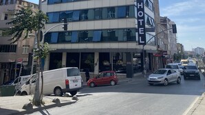 A multi-story hotel with a prominent sign reading "FINA HOTEL". - Lina Suit Hotel (Istanbul)