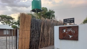 A gated entrance with a sign indicating a conference reception area.