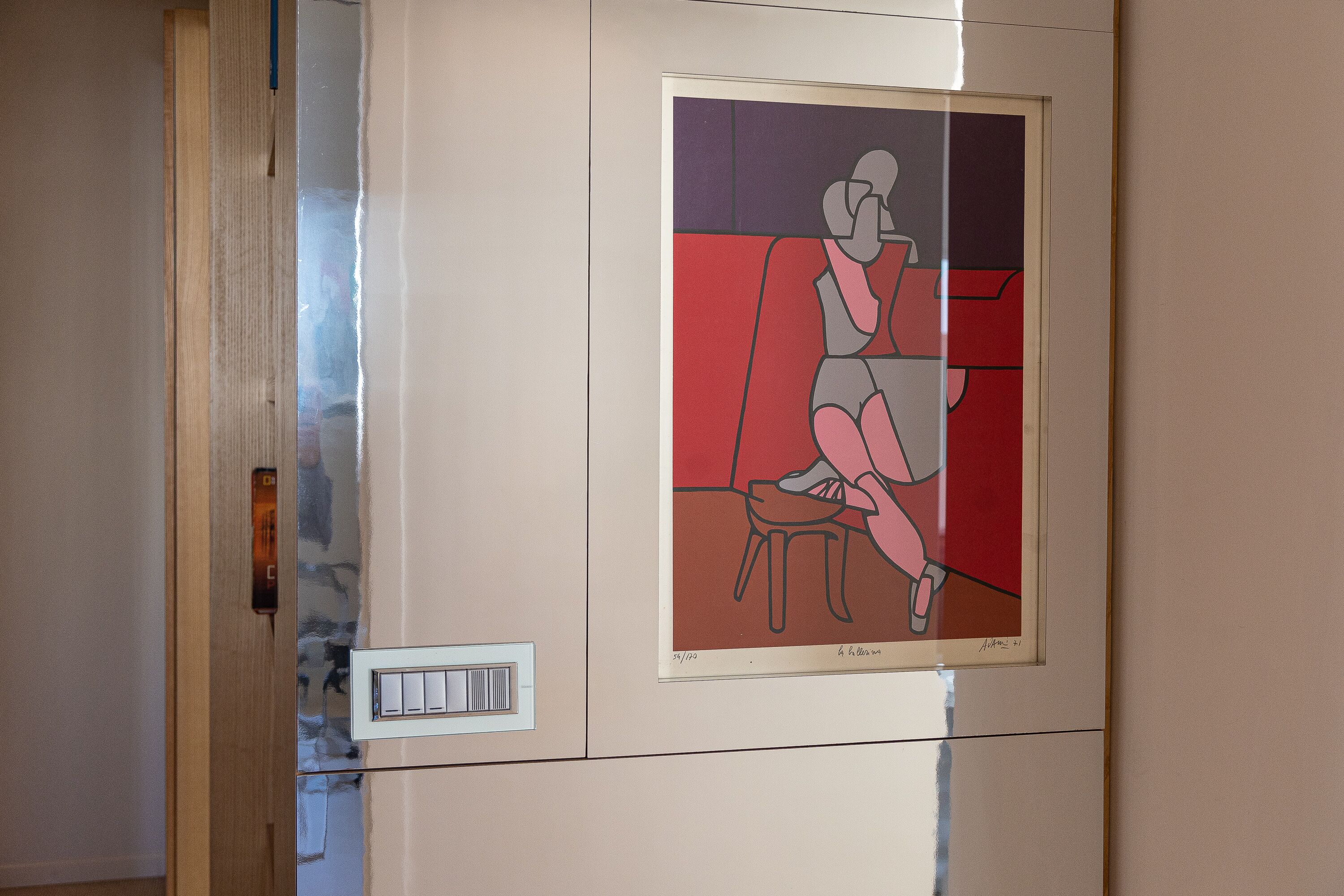 A framed artwork on a wall.