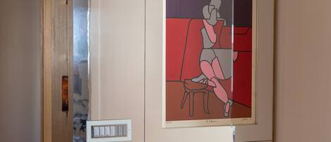 A framed artwork on a wall.