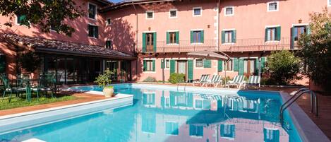 Seasonal outdoor pool, pool loungers