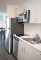 Basic Studio Suite, 2 Queen Beds | Private kitchen | Full-size fridge, microwave, stovetop, dishwasher