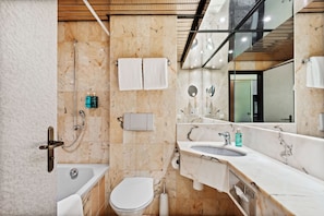 Bathtub, hair dryer, towels