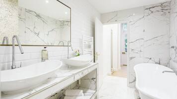 Bathtub, hair dryer, towels