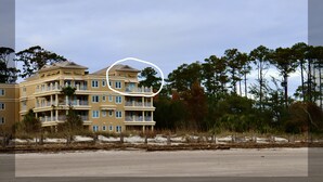 A multi-story hotel with balconies and a beach view. - Oceanfront Penthouse Overlooking the Atlantic Ocean (Daufuskie Island)