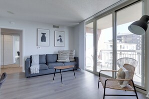 Comfort Apartment, 2 Bedrooms, City View | Living area | 50-inch Smart TV with cable channels, TV, fireplace