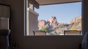 A room with a view of rocky mountains through a large window. - So Zion Painted Desert-4Bed, 3Bath, Hot Tub, Deck (Hildale)