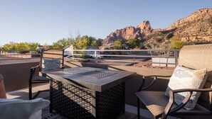 An outdoor seating area with a view of a mountain range. - So Zion Painted Desert-4Bed, 3Bath, Hot Tub, Deck (Hildale)