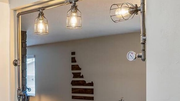 A breakfast setup with a coffee maker, juice, and plates of food. - The Industrial - Pet Friendly Home with Garage by Boise Fairgrounds (Boise)
