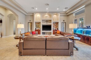 Smart TV, fireplace, table football, books