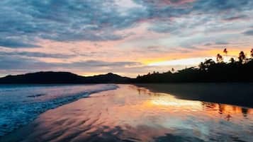 Private beach nearby, black sand, beach bar