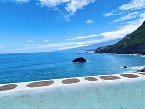 On the beach, sun-loungers, beach towels
