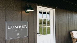 A wooden building with a sign reading "Lumber Lodge". - Lumber Lodge RRG - COMFY WOODSY STAY - in RRG/Auxier (Pine Ridge)