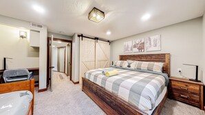 A bedroom with a wooden bed, a desk, a chair, and a wardrobe. - Summer in Park City, Dog Friendly, Game Room, Hot Tub, Grill, Playground (Park City)