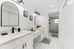 Combined shower/tub, hair dryer, towels, toilet paper