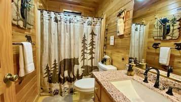 Combined shower/tub, hair dryer, towels, soap