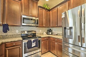 Enjoy cooking in this well-equipped kitchen with a double oven and large refrigerator.