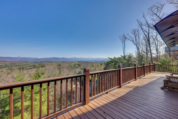 A wooden deck with a railing overlooking a forested landscape. - Mountain-View Murphy Cabin w/ Shared Fire Pit (Murphy)