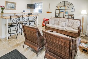 Deluxe Condo, 1 Bedroom | Living area | 43-inch flat-screen TV with cable channels, DVD player