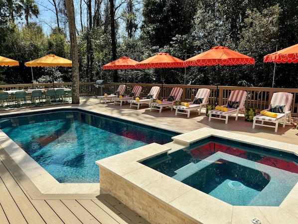 A heated pool, sun loungers