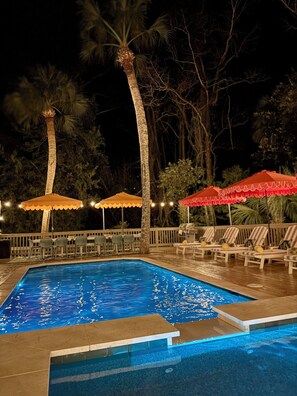 A heated pool, sun loungers