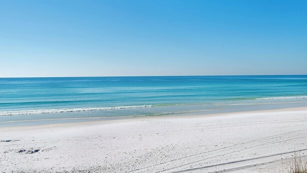 A beach with a clear sky and calm sea. - Beach Access Condo with Pool and Hot Tub (Miramar Beach)