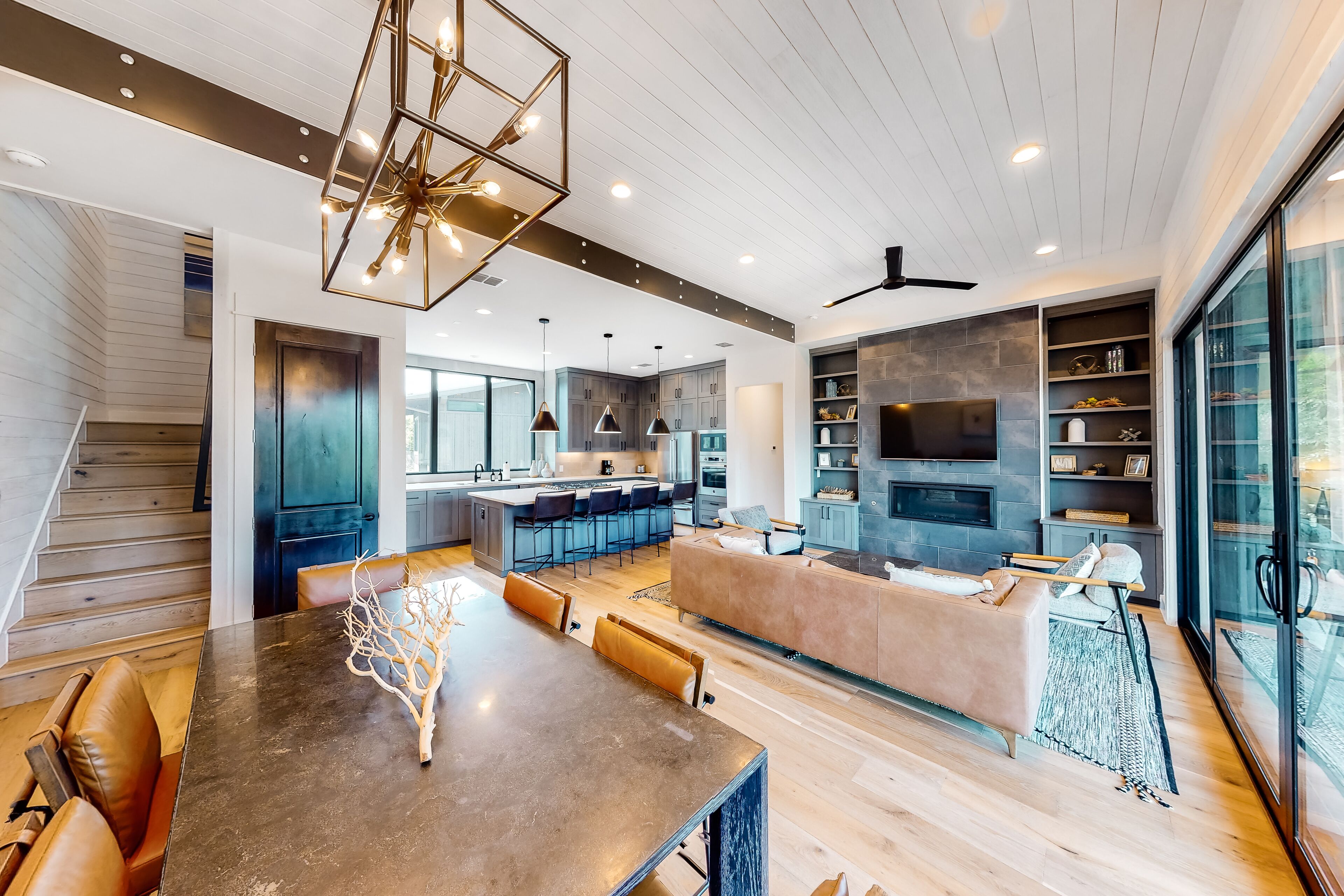 Luxe lake treehouse with designer interior, outdoor kitchen & living