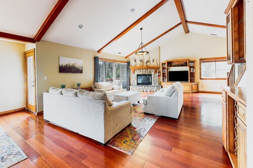 Sunny & spacious home with mountain & lake views, a game room, & fireplaces