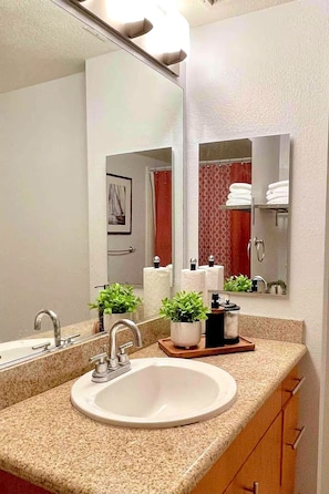 Combined shower/tub, hair dryer, towels, soap
