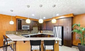 Coffee/tea maker, fridge, microwave, oven