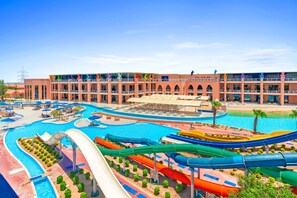 A hotel with multiple swimming pools, water slides, and a large building with balconies. - Pickalbatros Water Valley Resort - Neverland Hurghada (Safaga)
