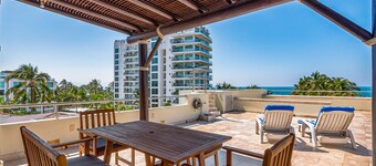 Ocean-view condo with private rooftop pool, terrace, & resort-style pool