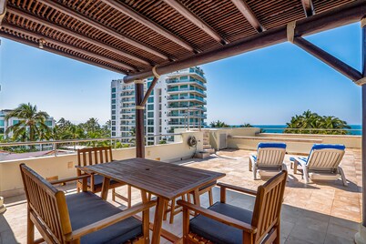 Ocean-view condo with private rooftop pool, terrace, & resort-style pool