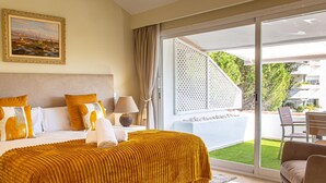 A hotel room with a bed, a nightstand, a lamp, a painting, and a view of the outdoors. - Luxurious penthouse in Marbella with pool, WiFi, pets allowed, air conditioning (Marbella)