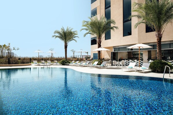 Outdoor pool - Holiday Inn Hotel & Suites Dubai Science Park by IHG (Dubai)