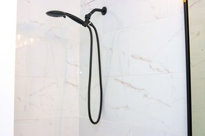 Combined shower/bathtub, towels, toilet paper - Beautiful Condo (Chicago)