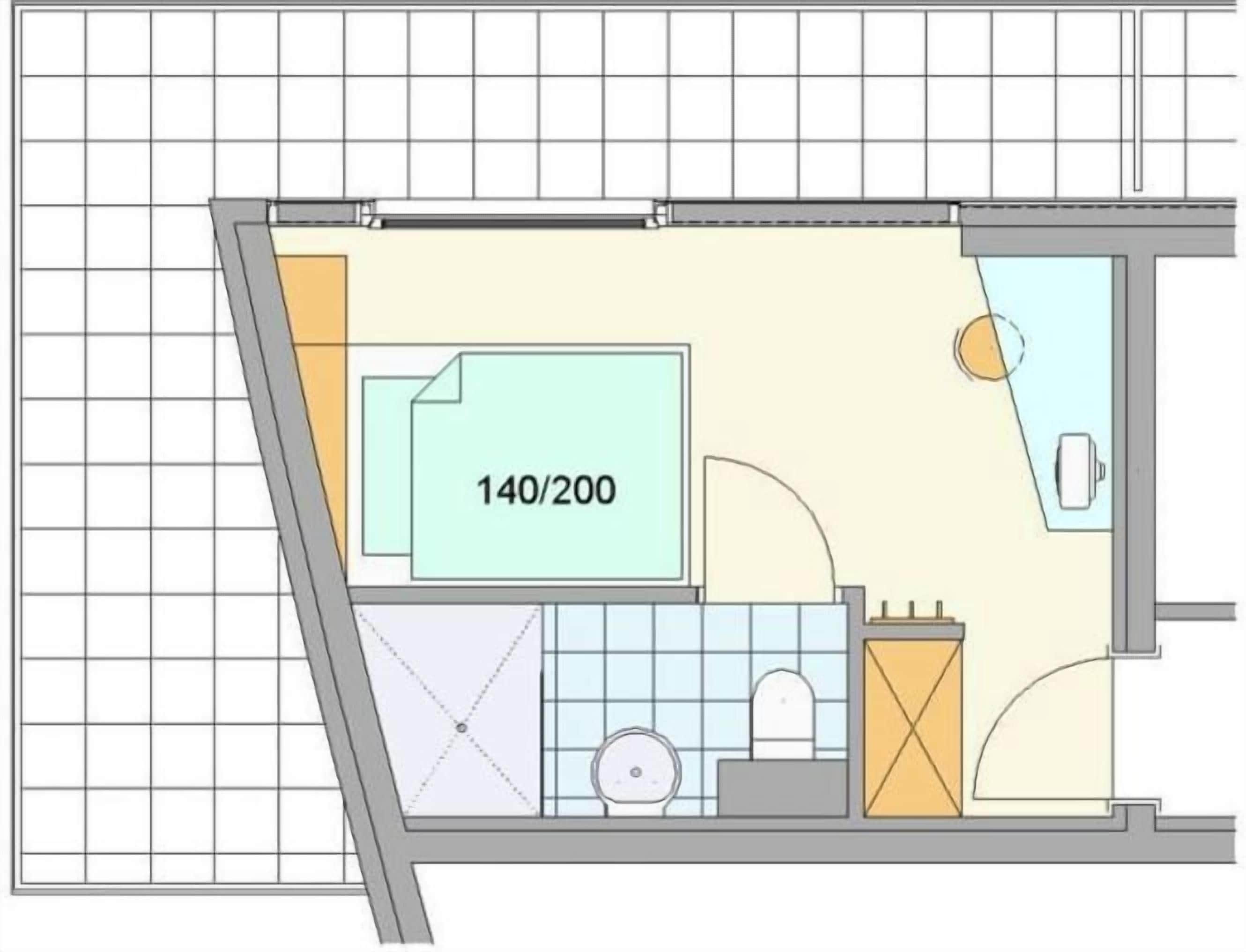 A floor plan of a hotel room with a bathroom, a kitchenette, and a seating area.
