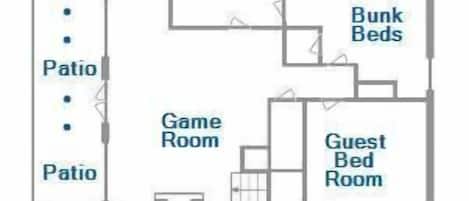 Plànol d'un hotel que inclou bany, lliteres, sala de jocs, habitació addicional i dos patis.