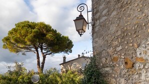 A stone building with a traditional lantern and a tree in front. - Mougins Collection - Authentic house - Old Village of Mougins (Mougins)